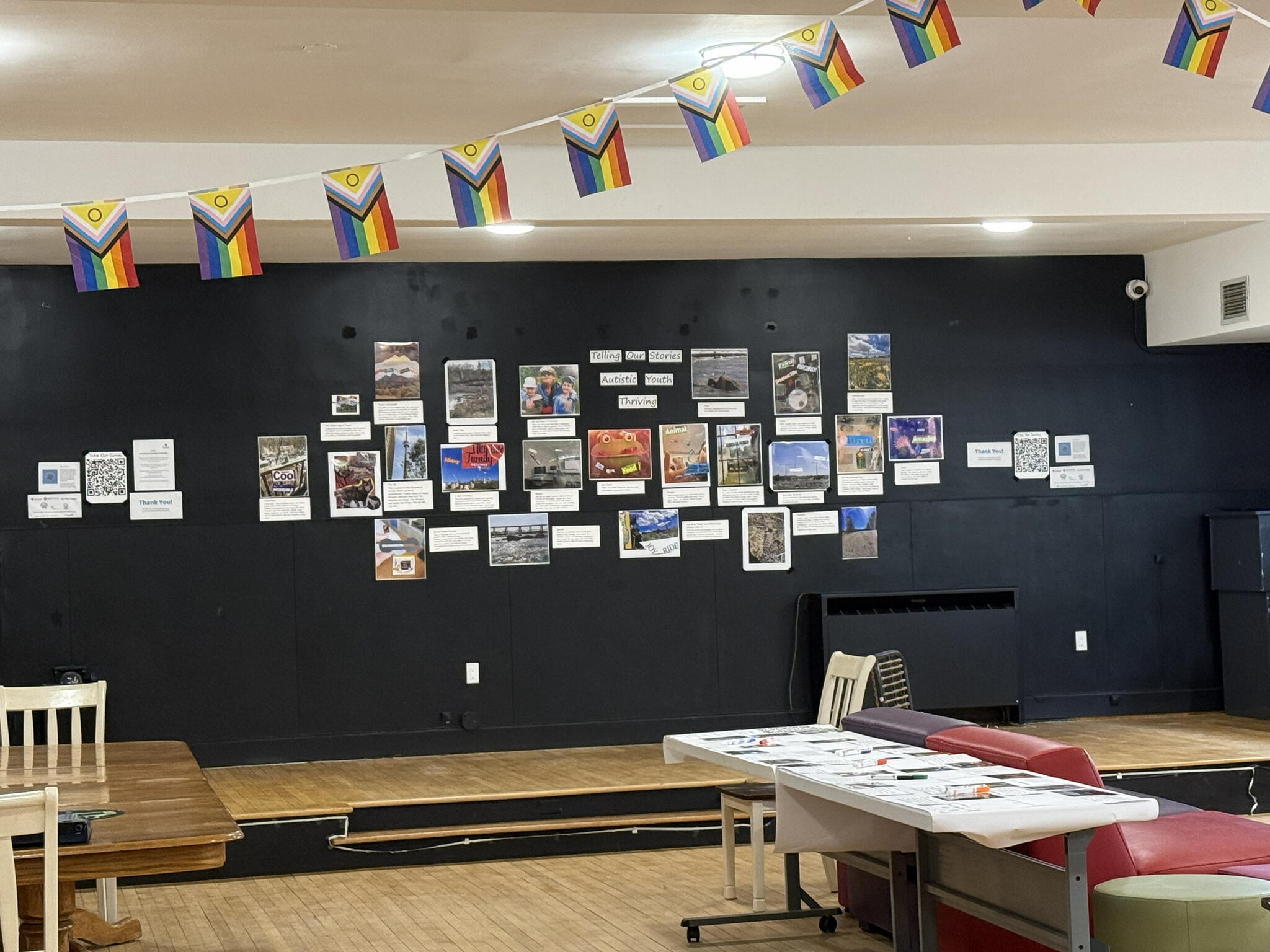 an image of a room with artwork up on the walls with some text beside it