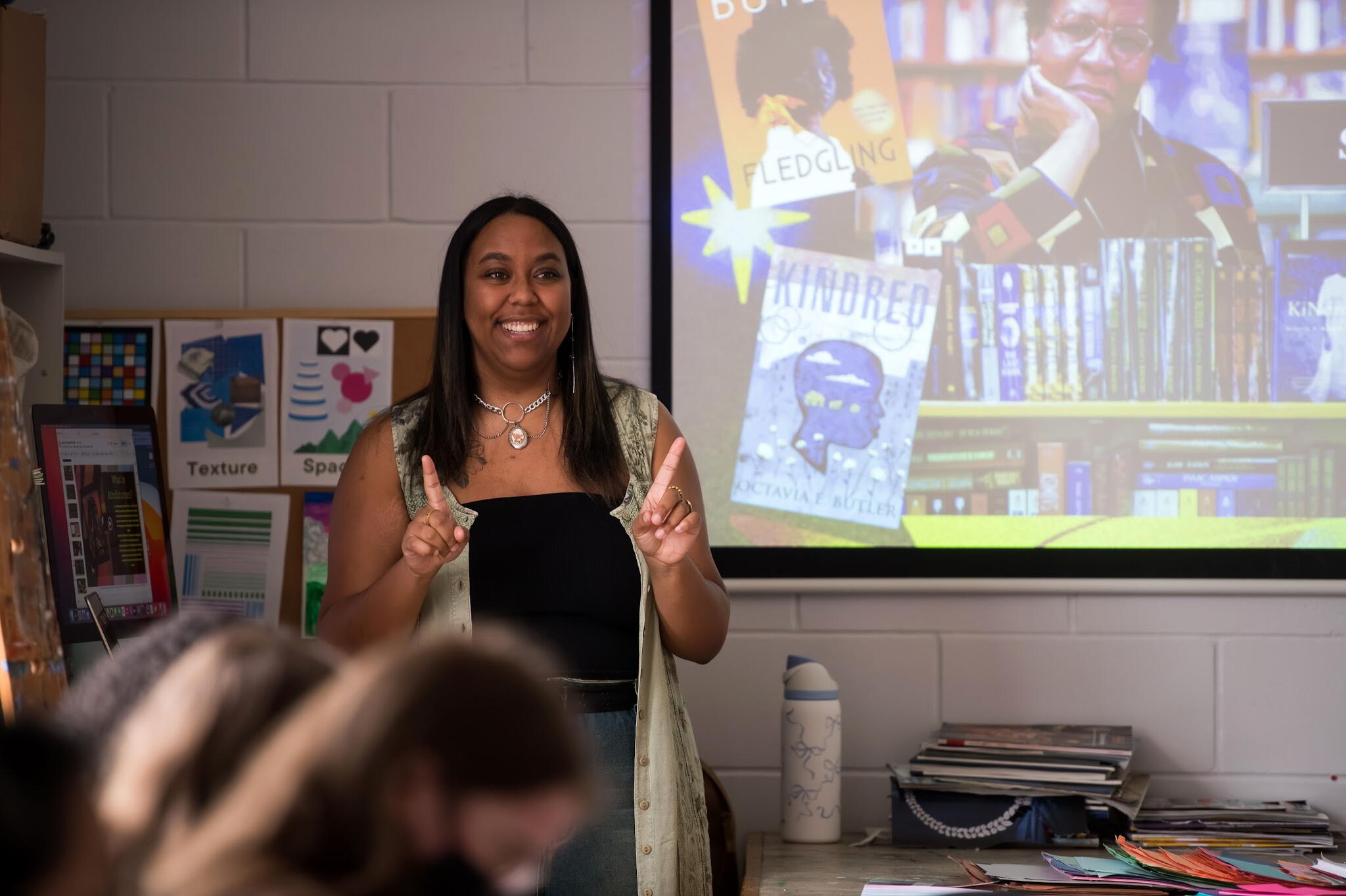 A black woman running an Arts Workshop