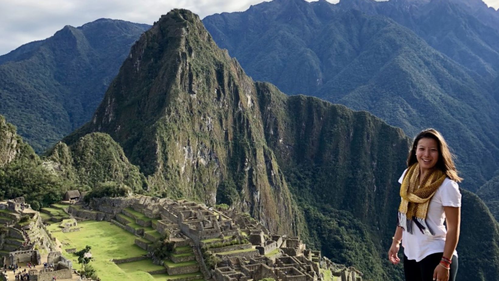 Kristin Lum-Tuong stands in front of a mountain.