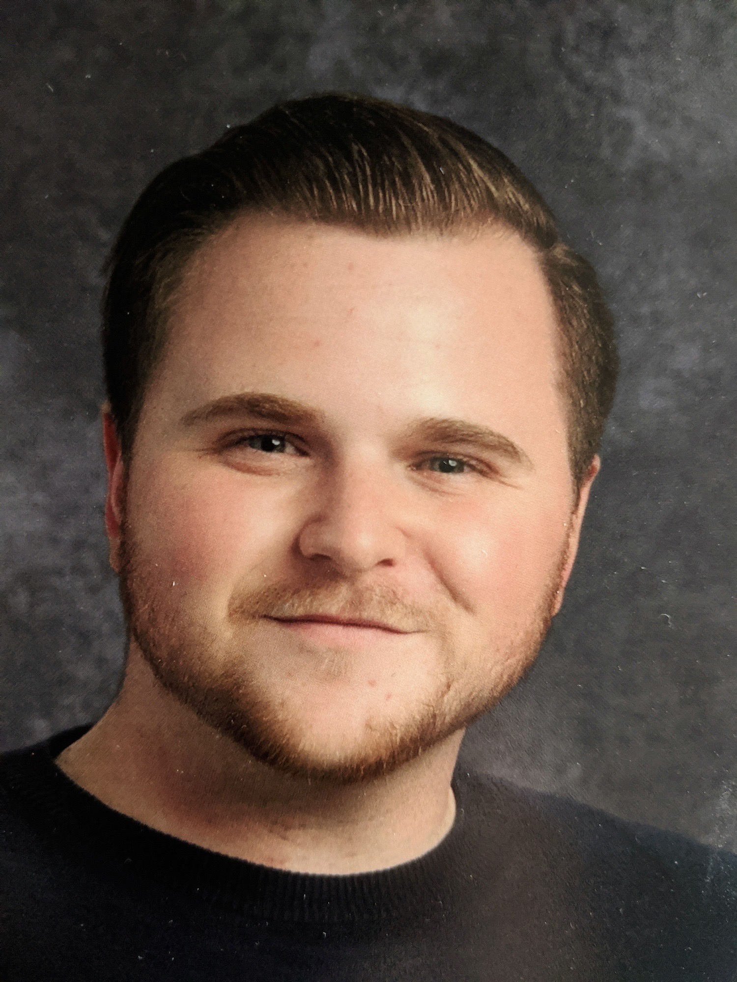 A white man smiling