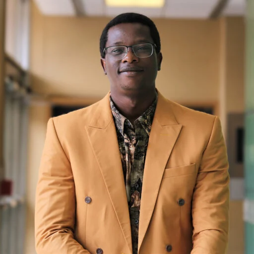 Ikeoluwapo Baruwa smiling at the camera