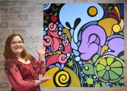 Portia posing in her studio with her acrylic on canvas mural. “My Creation,” for ASUS’ Reflection Room in Kingston Hall.