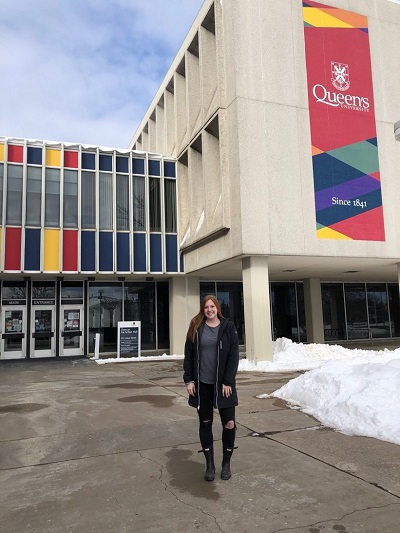 Jessi Zandbelt poses smiling outside of Duncan McArthur Hall.