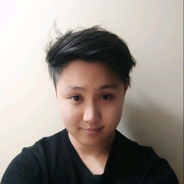 David Lyu smiles wearing a black t-shirt.