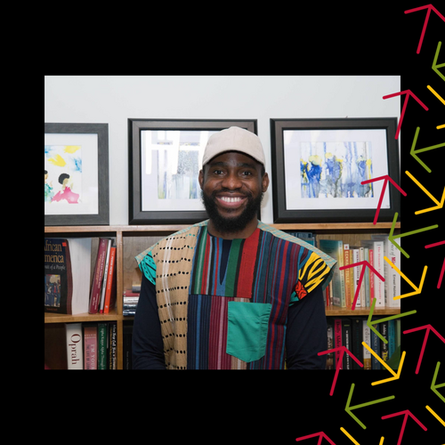 Paul Akpomuje smiles in front of a book shelf wearing a baseball cap. There is a black border with yellow, red, and green arrows overlayed over the right side.