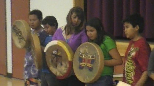 A picture of children playing drums