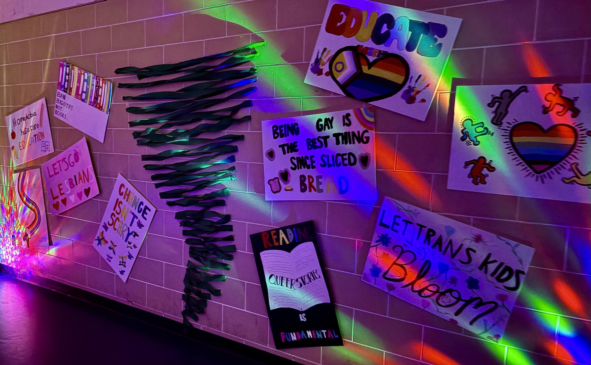 Decorations at Queer Prom included signs with words like "Being gay is the best thing since sliced bread" and "Change isn't scary."
