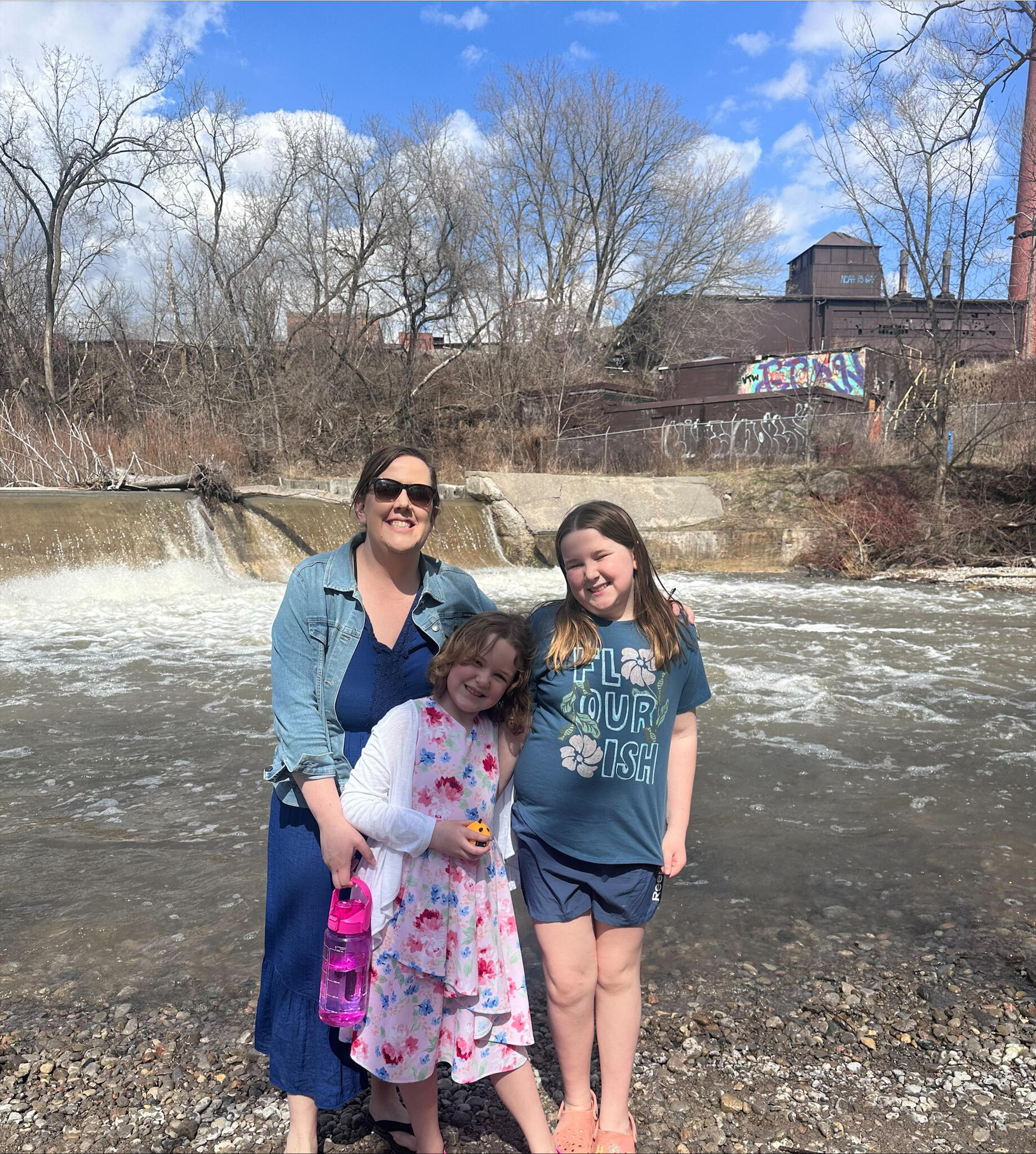Nicole and her daughters pose outside