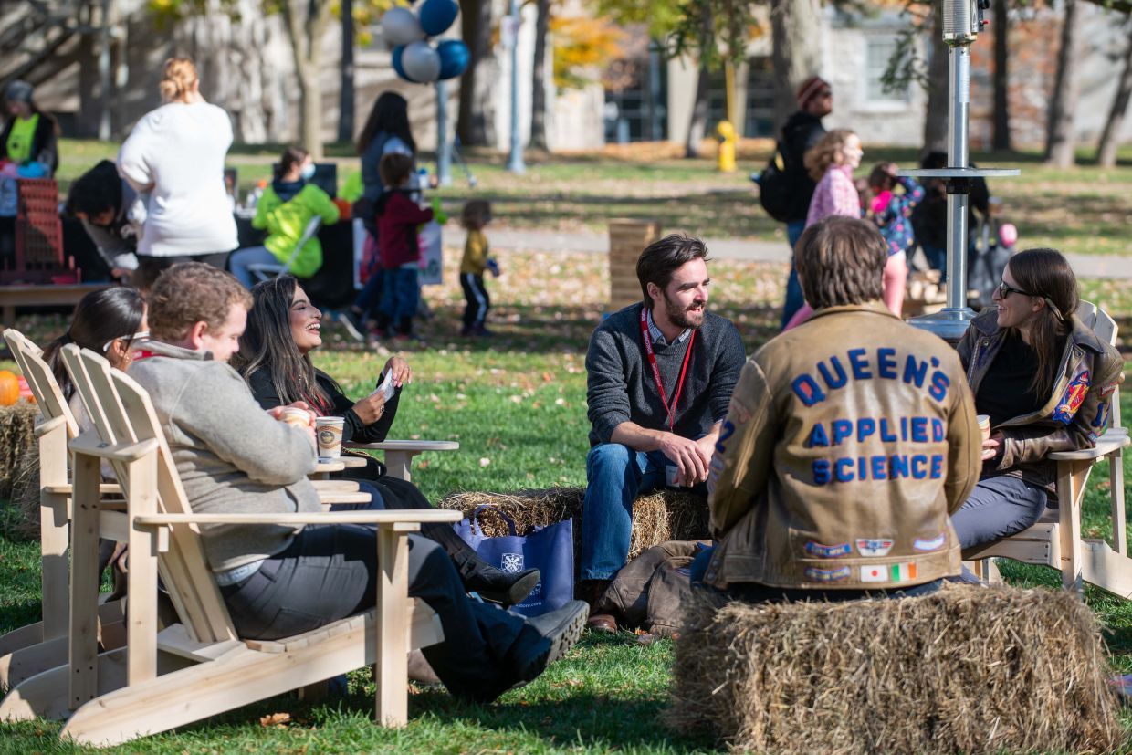 Students laughing outside in a fall setting