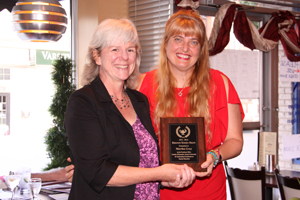 A Faculty Liaison and Associate Teacher with her award.
